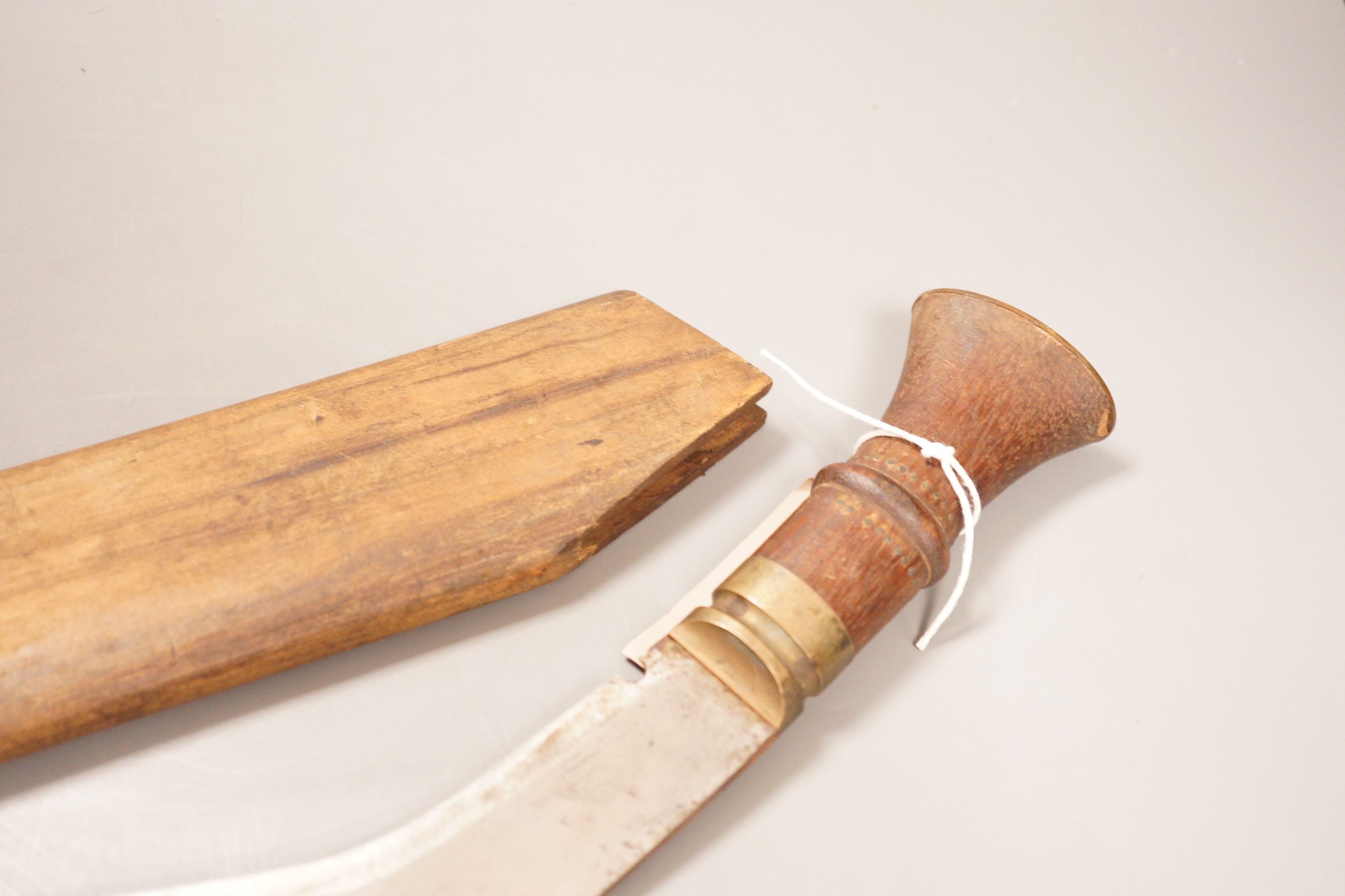 A kukri with hardwood handle and sheath